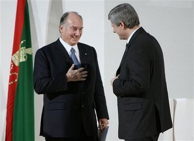 The Aga Khan, the 49th Hereditary Imam of the Shia Imami Ismaili Muslims, left, and Canada's Prime Minister Stephen Harper at the Delegation of the Ismaili Imamat Building Ottawa