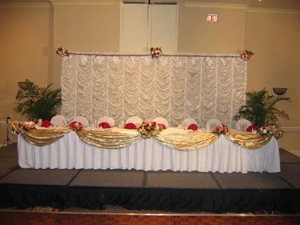 reception headtable white backdrop.jpg